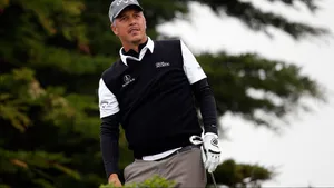 Professional Golfer Freddie Jacobson Skillfully Holding A Golf Club. Wallpaper