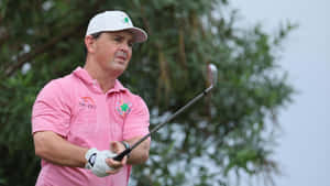 Professional Golfer Greg Chalmers Wearing A Pink Collared Shirt Wallpaper