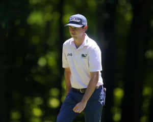 Professional Golfer J.t. Poston In Action On The Course. Wallpaper