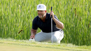 Professional Golfer Scott Piercy Relaxing On The Course Wallpaper