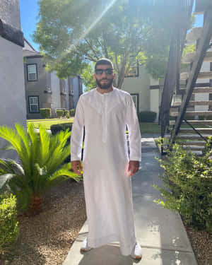 Professional Mma Fighter Amir Albazi In A Relaxed Pose At Home Wallpaper