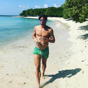 Professional Tennis Player Feliciano Lopez At Beach Wallpaper