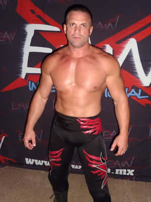 Professional Wrestler Posing Red Black Attire Wallpaper