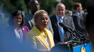 Prominent Politician Barbara Lee In Vibrant Yellow Suit Wallpaper