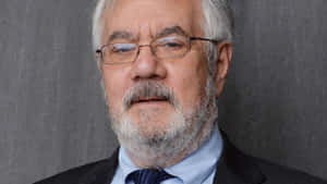 Prominent Politician Barney Frank Against A Gray Background Wallpaper