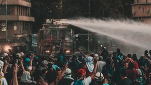 Protesters_ Facing_ Water_ Cannon Wallpaper