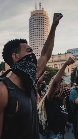 Protesters Raising Fistsin City Wallpaper