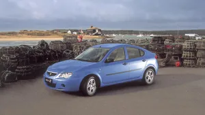 Proton Car Speeding On The Highway During Sunset Wallpaper