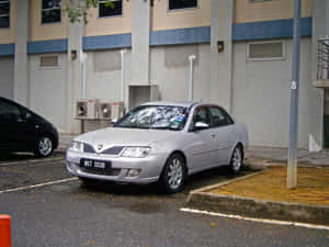 Proton Waja Silver Parked Outdoors Wallpaper