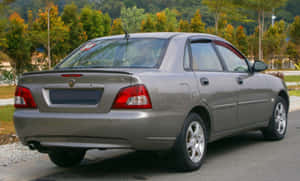 Proton Waja Silver Sedan Parked Outdoors Wallpaper