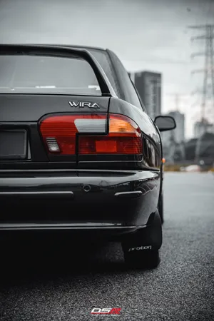 Proton Wira Rear View Urban Backdrop Wallpaper