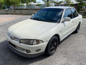 Proton Wira White Sedan Parked Outdoors.jpg Wallpaper