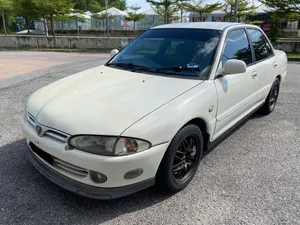 Proton Wira White Sedan Parked Outdoors.jpg Wallpaper