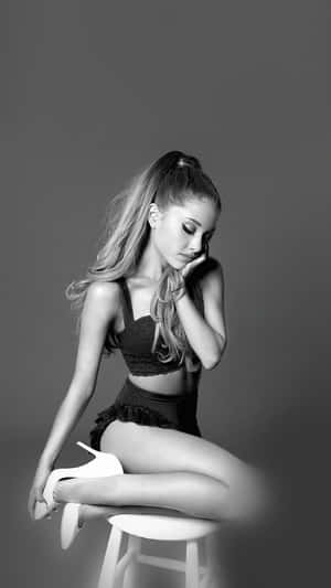 Provocative Pose Of Ariana Grande Wallpaper