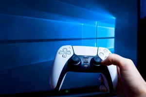 Ps5 Controller In Hand Wallpaper