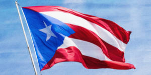 Puerto Rican Flag On White Pole Wallpaper