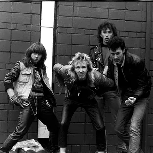 Punk Band Brick Wall Pose Wallpaper