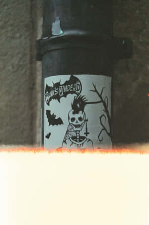 Punk Undead Sticker On Pipe.jpg Wallpaper