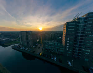 Purmerend Sunset Over Waterfront Buildings Wallpaper