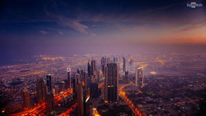 Purple Dusk Cityscape Captures The Magic Of The Night Wallpaper