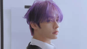 Purple Haired Man Side Glance Wallpaper