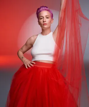Purple Haired_ Person_in_ White_ Top_and_ Red_ Tulle_ Skirt Wallpaper