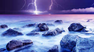 Purple Lightning Over Rocky Sea Wallpaper