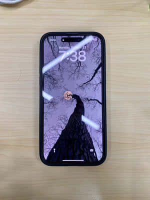 Purplei Phone14 Pro Maxwith Halloween Theme Wallpaper Wallpaper