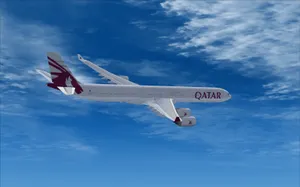 Qatar Airways In Flight Amidst Blue Sky Wallpaper