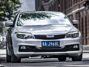 Qoros Car Driving On The Road Wallpaper