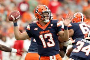 Quarterback Action Pass Orange Uniform Wallpaper