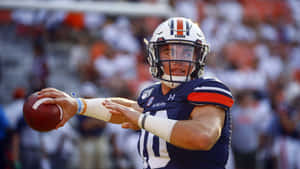 Quarterback Bo Nix Preparingto Throw Wallpaper