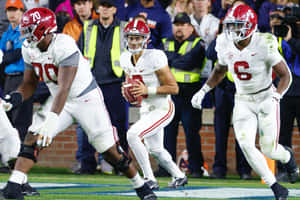 Quarterback Bryce Young In Action Wallpaper