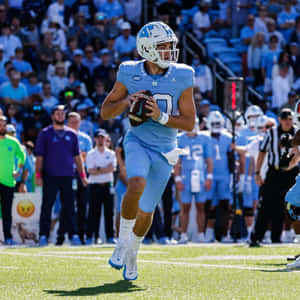 Quarterback Drake Maye In Action Wallpaper