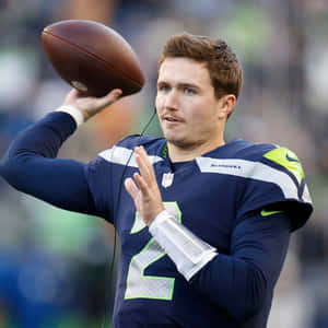 Quarterback Preparingto Throw Football Wallpaper