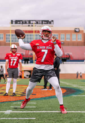 Quarterback Throwing At Senior Bowl Wallpaper