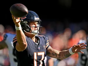 Quarterback Throwing Football Action Wallpaper