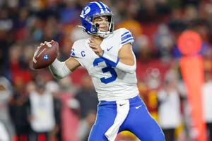 Quarterback Throwing Football Game Wallpaper