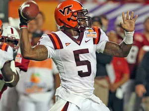 Quarterback Throwing Football Game Wallpaper