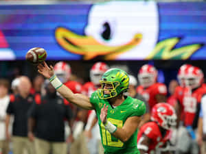 Quarterback Throwing Football Game Wallpaper