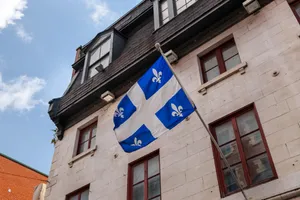 Quebec_ Fleurdelis_ Flag_on_ Building Wallpaper
