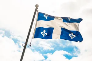 Quebec_ Fleurdelise_ Flag_ Waving Wallpaper
