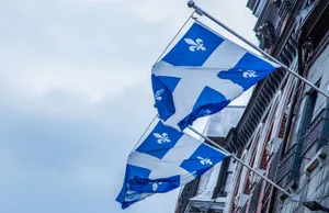 Quebec_ Fleurdelise_ Flags_ Waving Wallpaper