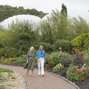 Queen Camilla Walking Through Garden Wallpaper