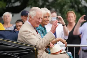 Queen Camilla Waving On Carriage Wallpaper