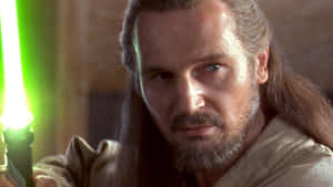 Qui-gon Jinn, The Master Jedi In Action Wallpaper