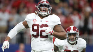 Quinnen Williams Celebration On Field Wallpaper