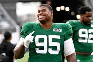 Quinnen Williams Smiling During Practice Wallpaper