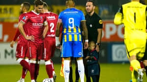 R K C Waalwijk Match Momentwith Child Mascot Wallpaper