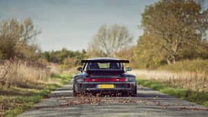 R W B Porsche On Country Road Wallpaper